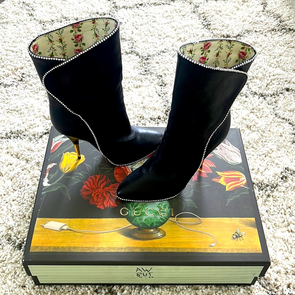 Black Gucci boots. Like New. Size 39. Have box, spare heel and caps travel bag.